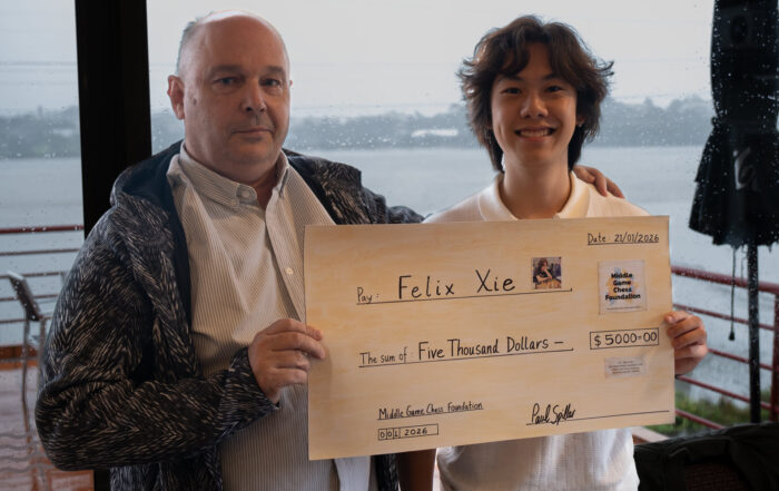 Felix Xie receiving his $5,000 scholarship cheque from MGCF Treasurer Martin Dreyer
